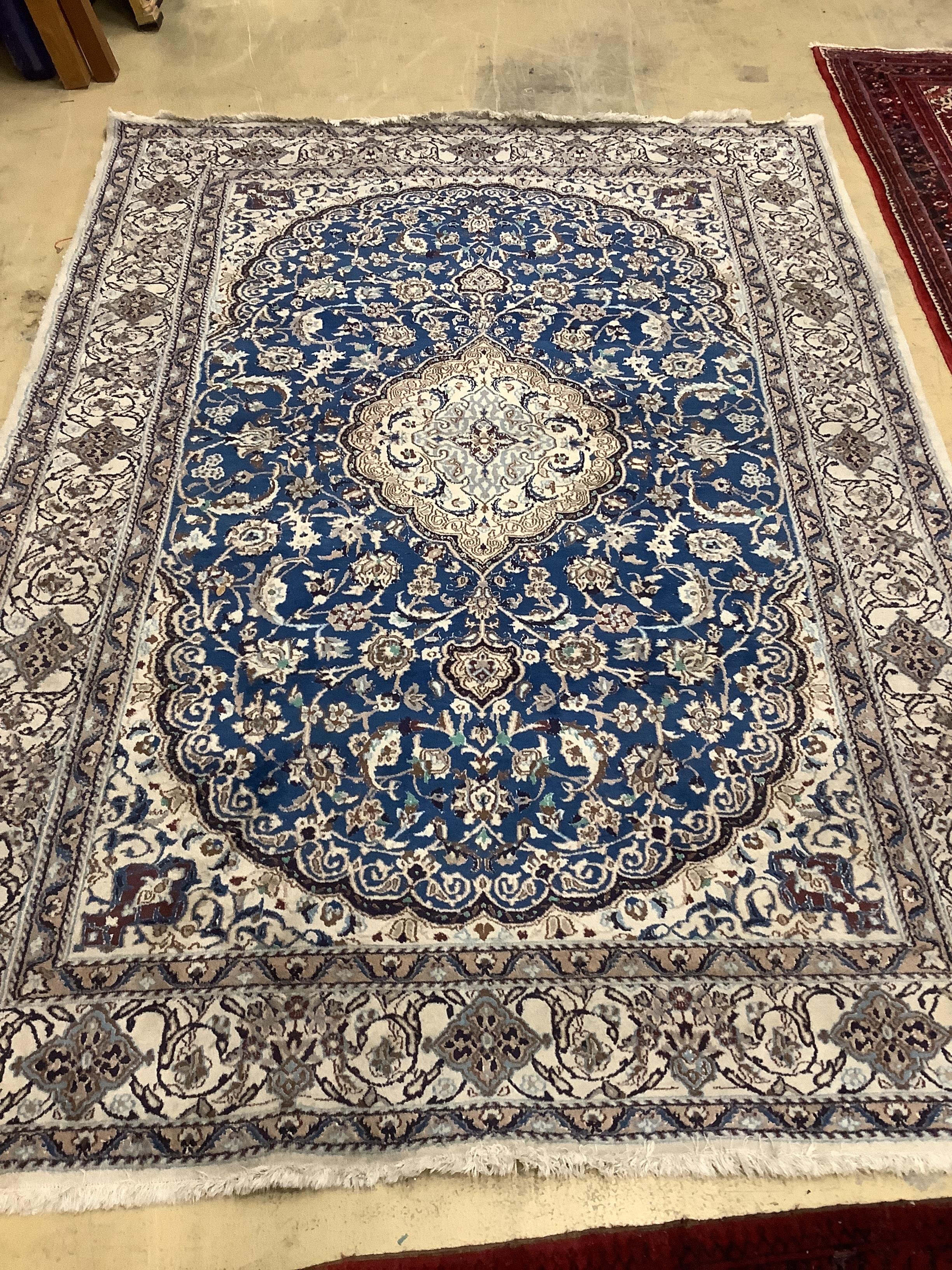 A Kashan style blue ground carpet, 340 x 244cm (a.f.)